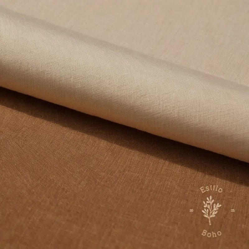 100% organic cotton fabric being carefully touched or held up.