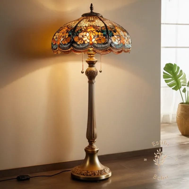 A stylish, golden bohemian floor lamp with unique glass shade.