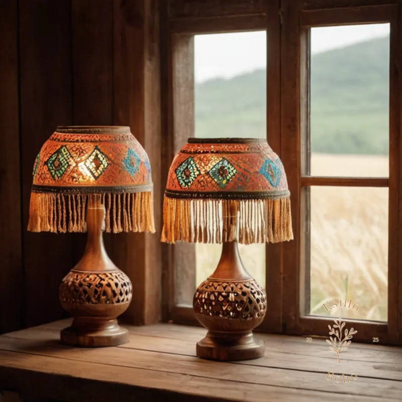 Bohemian-inspired lamps with fringe and tassels on rustic wooden bases.