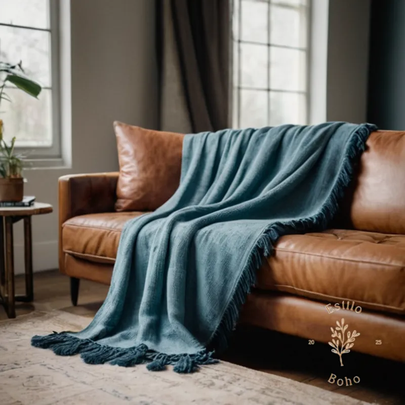 A long-fringed throw blanket draped beautifully on an eclectic couch.
