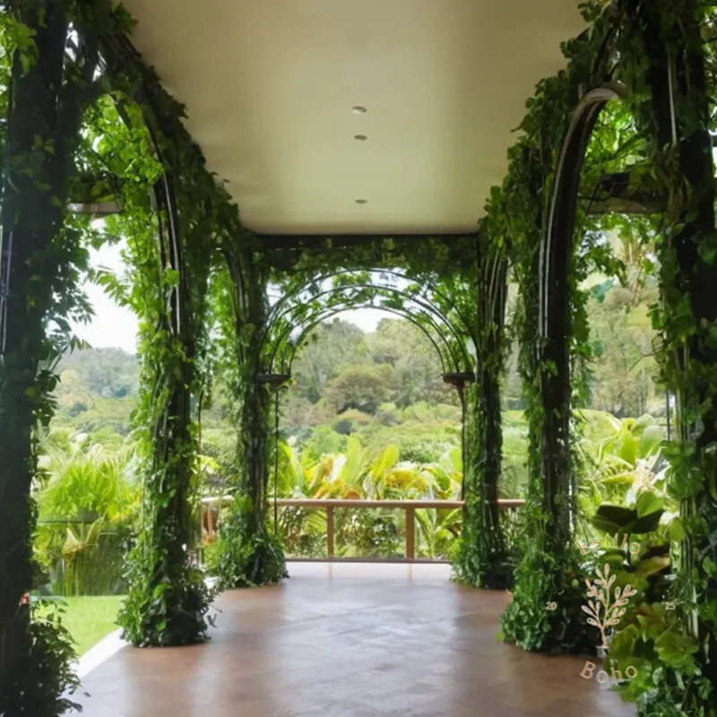 A lush, green indoor plant train with vines climbing a decorative arbor.